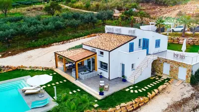 an aerial view of a house with a swimming pool at Villa Giulietta in Scopello