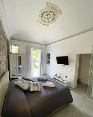 a bedroom with a large bed with pillows on it at Casa Chiara in Isola delle Femmine