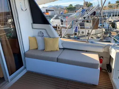 a seat on the back of a boat in a marina at Giorgia House Boat in Palermo