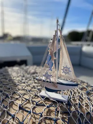 a small toy boat sitting on top of a table at Giorgia House Boat in Palermo
