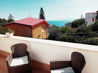 two chairs on a balcony with a view at Da Carmen e Peppe in Santa Flavia