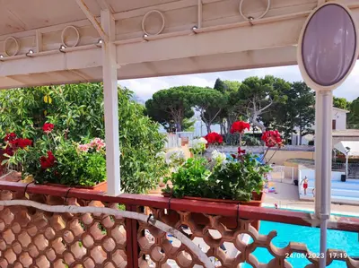a view of the pool from the balcony of a resort at Raggio di sole in Ashur in Palermo