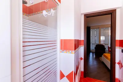 a hallway with red and white striped walls at Mondello luxury villa con piscina in Mondello