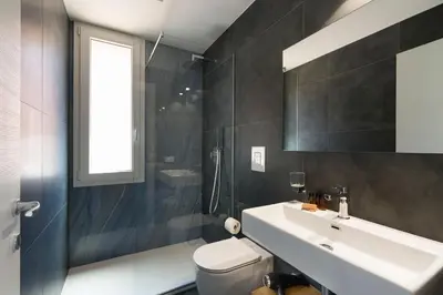 a bathroom with a white sink and a toilet at La Dolce Vita in Castellammare del Golfo