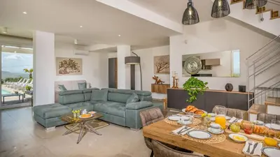 a living room with a couch and a table at DAMA DEI VENTI 6&2, Emma Villas in Castellammare del Golfo