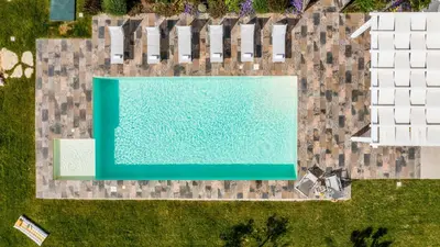 an overhead view of a swimming pool next to a house at DAMA DEI VENTI 6&2, Emma Villas in Castellammare del Golfo