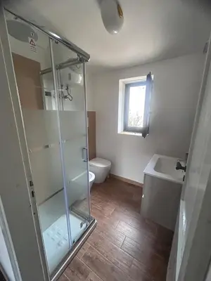 a bathroom with a shower and a toilet and a sink at villa Macari in San Vito lo Capo