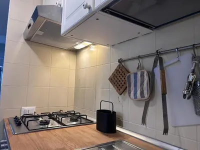 a kitchen with a stove and a counter top at villa Macari in San Vito lo Capo