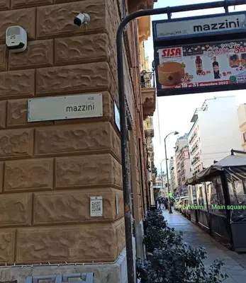 a street sign on the side of a building at Liberty Casa Mazzini 34 in Palermo