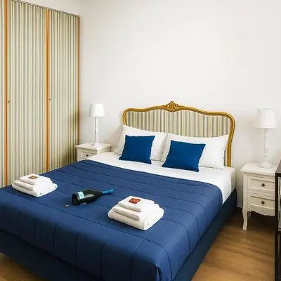 a bedroom with a blue bed with towels on it at Liberty Casa Mazzini 34 in Palermo