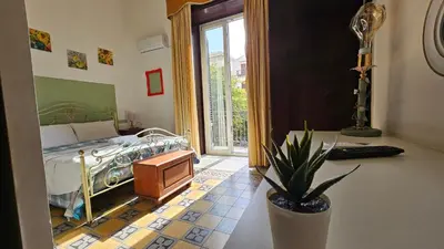 a hotel room with towels on a bed with a window at Teatro del Sole Cavour in Palermo