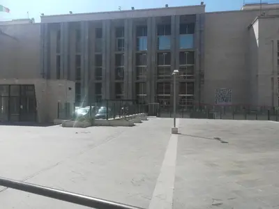 a large building with a street light in front of it at Hostel Centro Città Basement in Palermo