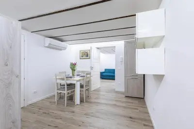 a kitchen and dining room with a table and chairs at GuestHost - Palermo Modern and Central Apartment x6 in Palermo