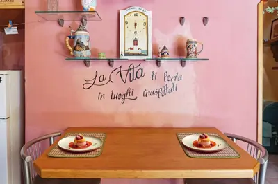 a table with two plates of food on top of it at CASA ARANCIO in Palermo