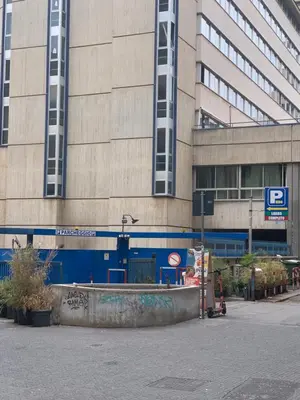 a building with a parking lot in front of it at Materesa in Palermo