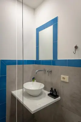 a bathroom with a sink and a toilet and a shower at A casa di Cilu - Centro Storico in Palermo