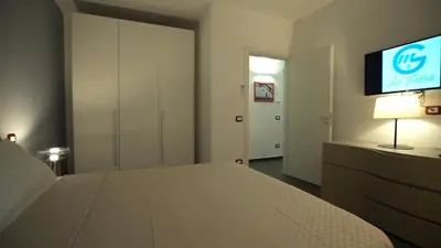 a bedroom with a bed and a flat screen tv at Mi Tierra Luxury Apartments in Palermo