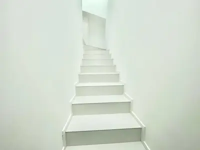an empty stair case in a white wall at Villa Eirene in Termini Imerese