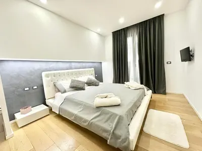 a bedroom with a large bed and a window at Villa Eirene in Termini Imerese