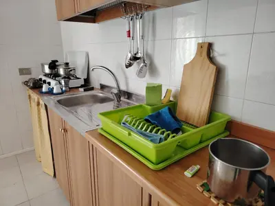 a kitchen with a green tray on top of a sink at Casa Derna 25dx Climatizzata in Castellammare del Golfo