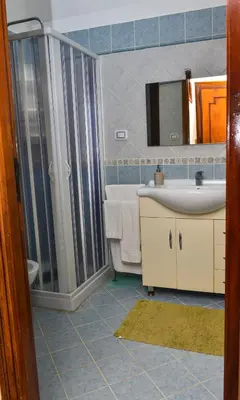 a bathroom with a sink and a shower at Amaryllis Apartments in Bagheria