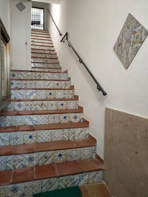 a staircase with a tile floor and a stair railing at Casa Lia al centro di palermo in Palermo