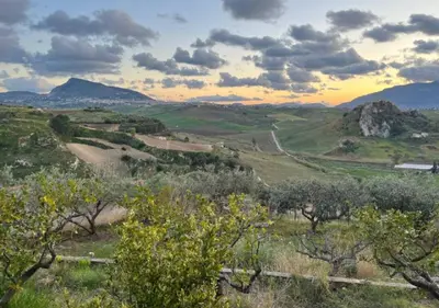 a view of a valley with trees and mountains at Villa Finestra sul Castello in Partinico