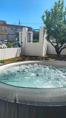 a hot tub in the backyard of a house at Casa Phimes in Calatafimi