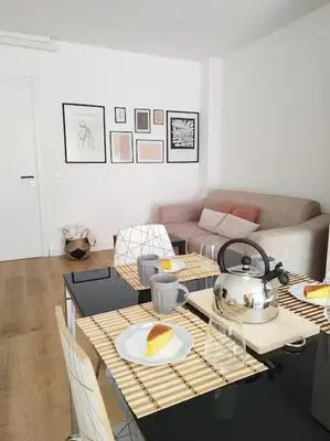 a living room with a table with a plate of food at Casa Phimes in Calatafimi