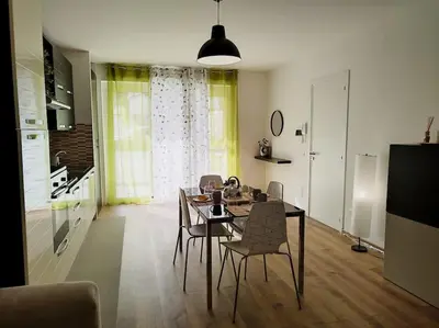 a living room with a dining room table and chairs at Casa Phimes in Calatafimi