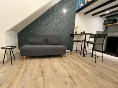 a living room with a couch and a table at CasaCecè kalsa in Palermo
