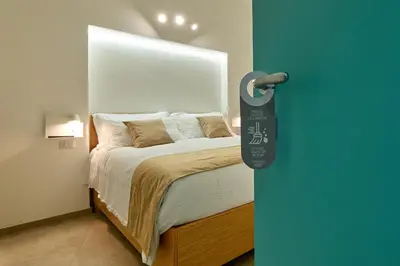 a bedroom with a bed with a door handle at La casa di Chele in Palermo