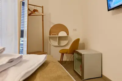 a hospital room with a bed and a chair at La casa di Chele in Palermo