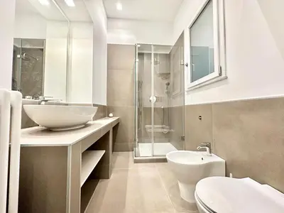 a bathroom with a sink and a toilet and a shower at PALAZZO LA ZAGARA in Palermo