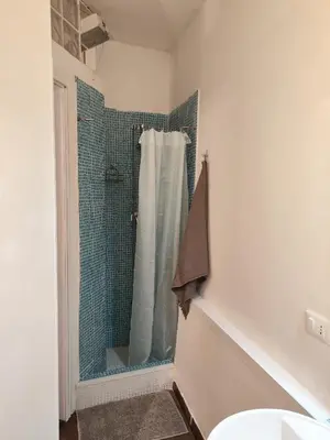 a bathroom with a shower and a sink at CASETTA SPECIALE in Palermo