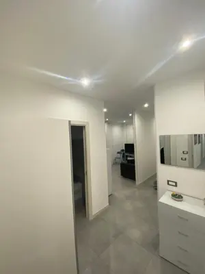 a white room with a sink and a mirror at City Life in Palermo
