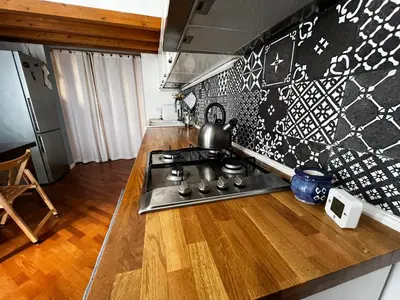 a kitchen with a stove and a counter top at A casa del Conte in Palermo