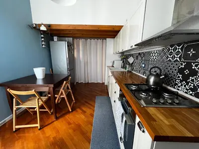 a kitchen with a table and a stove top oven at A casa del Conte in Palermo