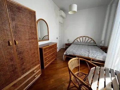 a bedroom with a bed and a dresser and a mirror at A casa del Conte in Palermo