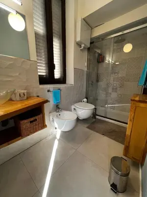 a bathroom with a toilet and a sink and a shower at A casa del Conte in Palermo