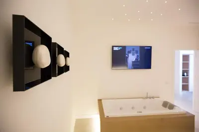 a desk with a computer monitor and a keyboard at Giada Luxury in Terrasini