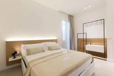 a dining room with a table and chairs in a room at Giada Luxury in Terrasini