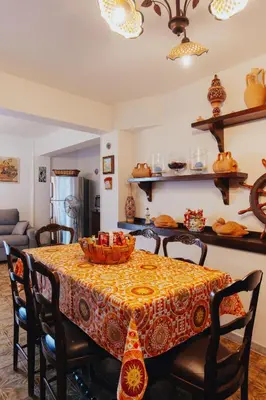 a dining room table with a bowl of food on it at Monia beach house in Santa Flavia