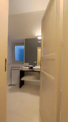 a bathroom with a sink and a mirror at Cassari 61 in Palermo