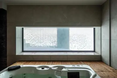 a bath tub in a bathroom with a window at Villa vista mare Piscina e SPA in Castellammare del Golfo