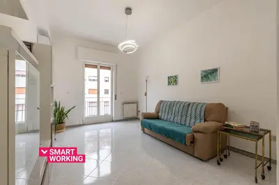 a living room with a couch and a table at Casa Lincoln by Wonderful Italy in Palermo