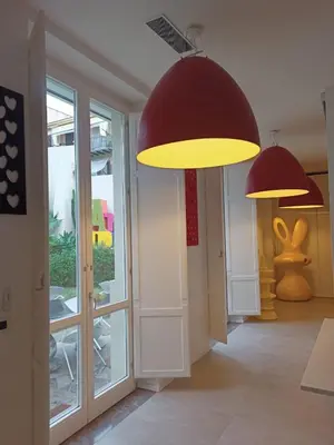 two lights hanging from the ceiling in a hallway at Casa Slide a Palermo in Palermo
