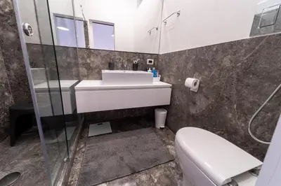 a bathroom with a sink and a toilet at Casa Slide a Palermo in Palermo