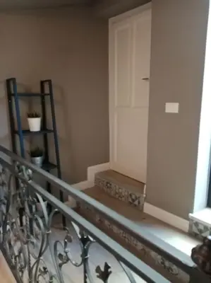 a stairway with a railing and a door in a room at Casa Allegra in Palermo