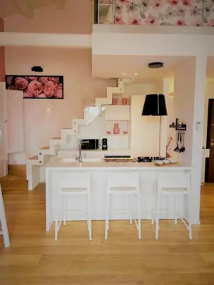 a kitchen with a white counter and a staircase at mialuxuryhouse in Palermo